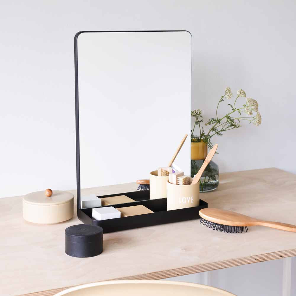 Mirror with a black shelf