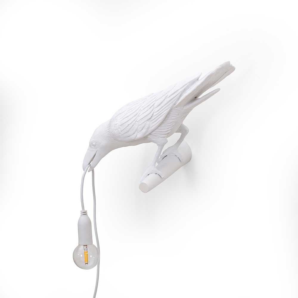 White bird lamp looking left